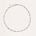 Delicate 18K gold vermeil necklace with alternating lavender zirconia beads and white freshwater pearls on cream background